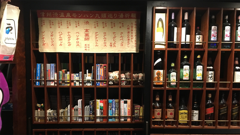 Classic video games share shelf space with bottles of liquor at Continue.